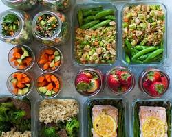 Healthy meal prep containers filled with fresh fruits, vegetables, and lean protein for weekly meal planning