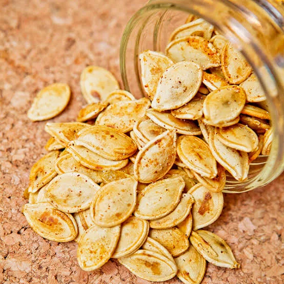 Unsalted pumpkin seeds containing magnesium and other nutrients that support a heart-healthy diet.